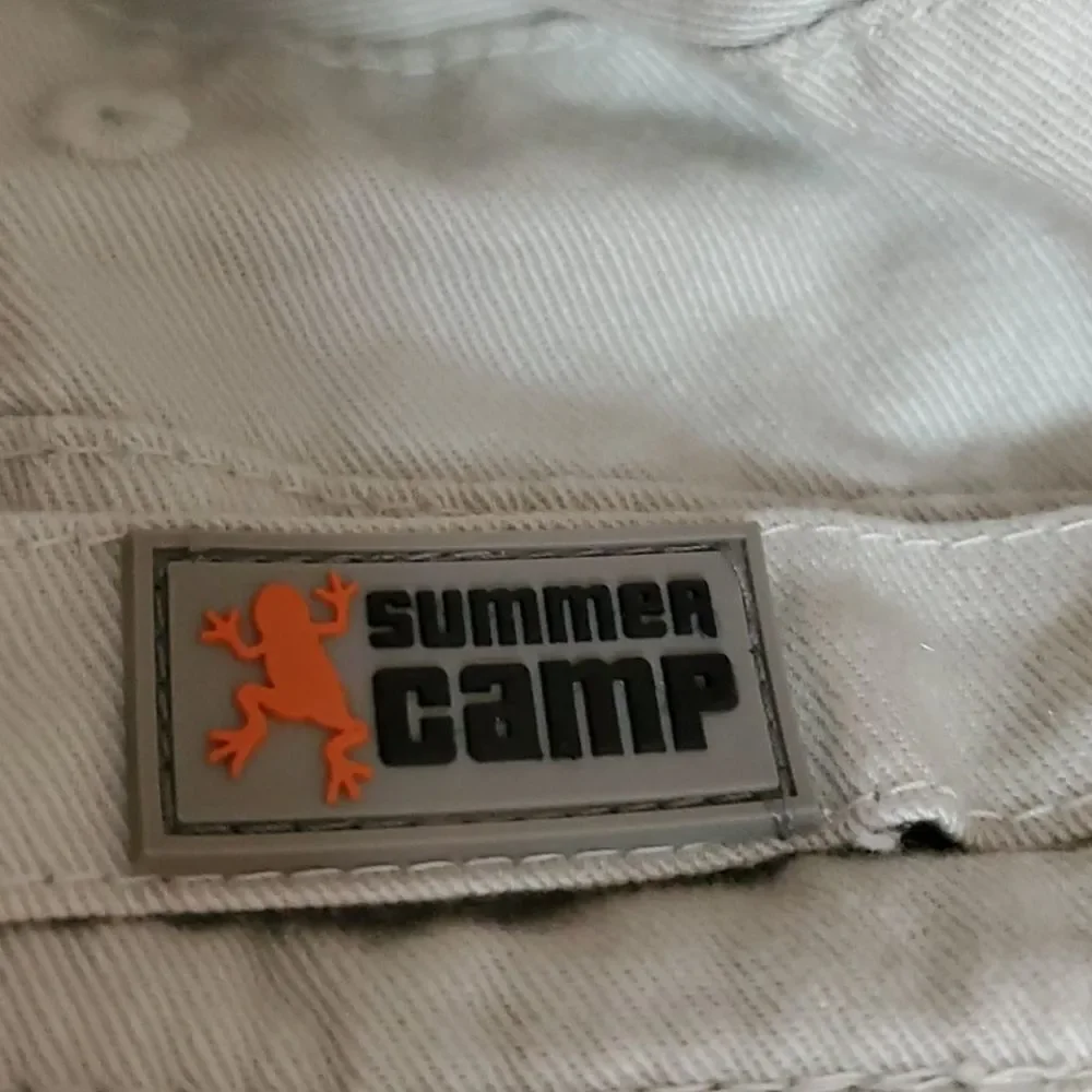Cute little reversible hat, by summer‎ camp.